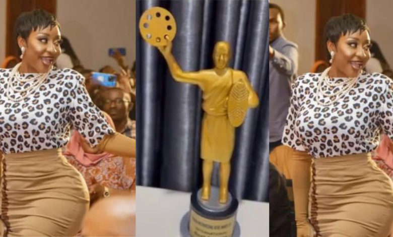 Ini Edo Displays Award She Won At The Rwanda International Movie Awards